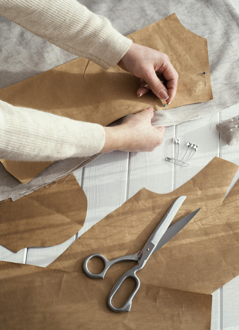 high-angle-seamstress-with-fabrics-scissors