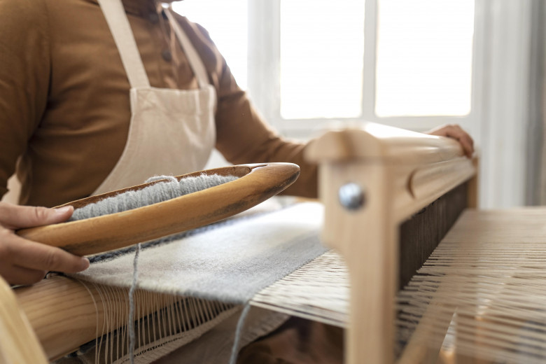 person-working-embroidery-workshop